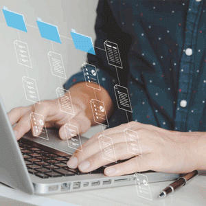 Person typing at laptop